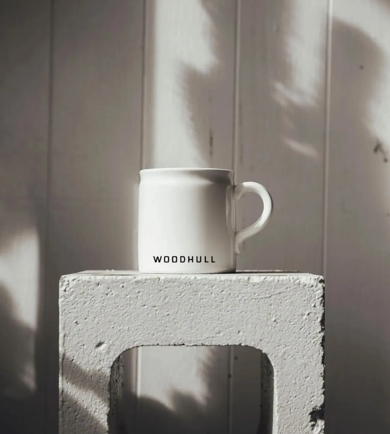 Custom-branded mug for Woodhull, highlighting branding expertise by an architecture marketing agency