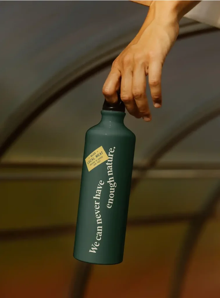 Food & beverage branding agency design for Walden Local water bottle with quote "We can never have enough nature" and brand logo.