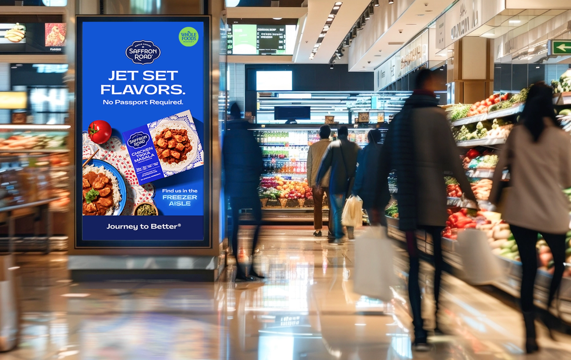 Shoppers walk in a grocery store aisle beside a digital ad for Saffron Road frozen meals, featuring the slogan Jet Set Flavors. No Passport Required.